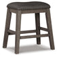 Caitbrook Upholstered Stool (2/CN) - Discount Furniture Connection