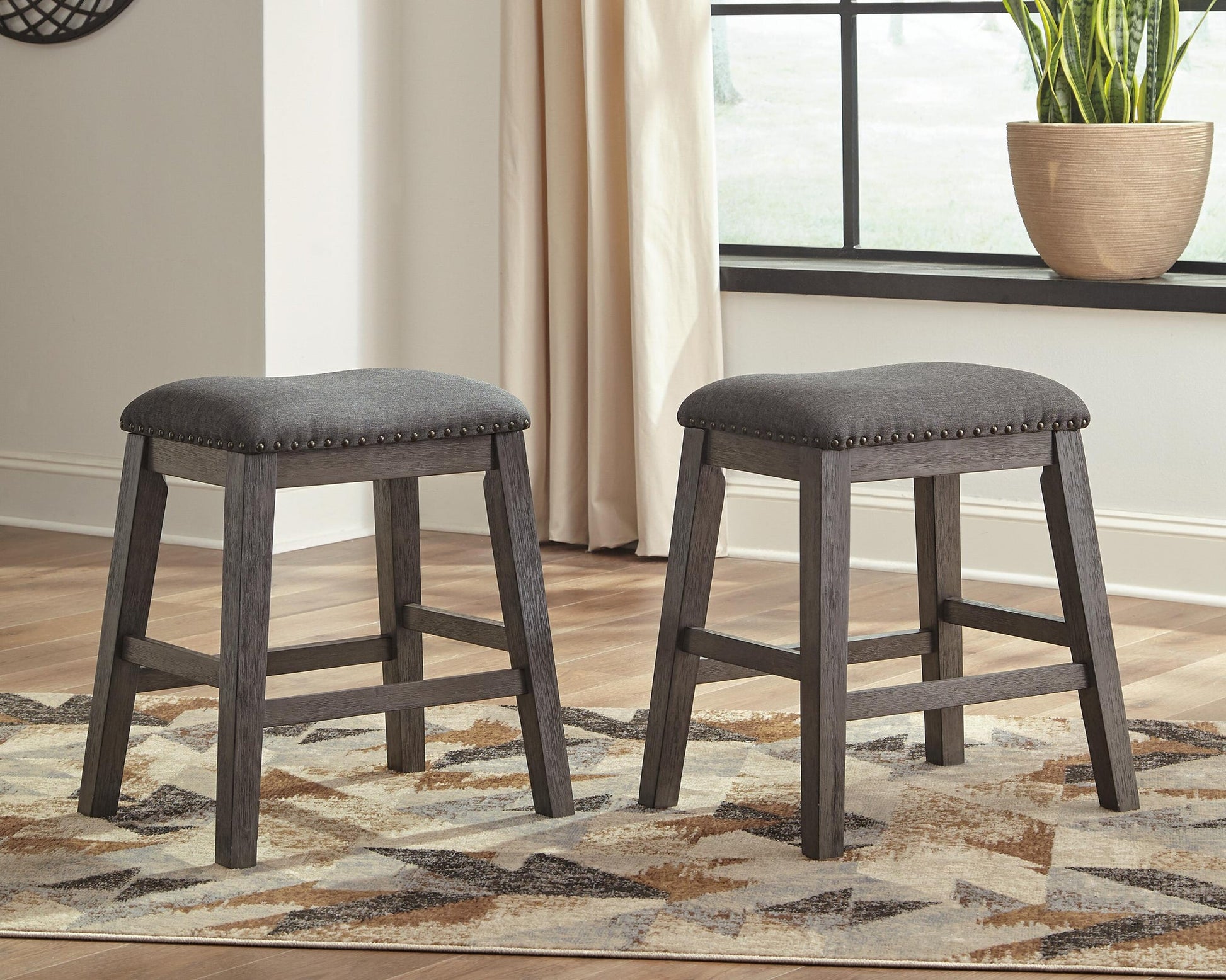 Caitbrook Upholstered Stool (2/CN) - Discount Furniture Connection