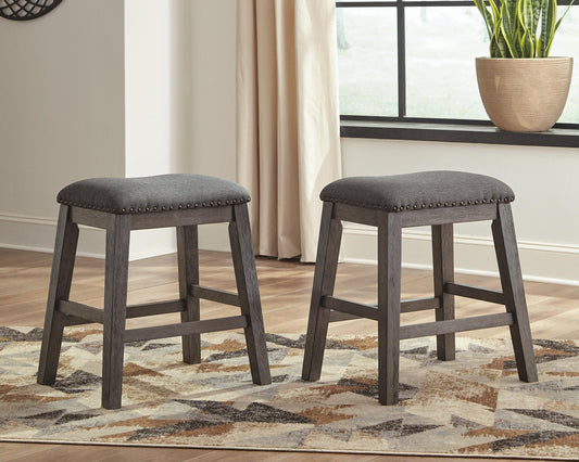 Caitbrook Upholstered Stool (2/CN) - Discount Furniture Connection