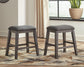 Caitbrook Upholstered Stool (2/CN) - Discount Furniture Connection