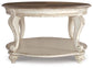 Realyn Oval Cocktail Table - Discount Furniture Connection
