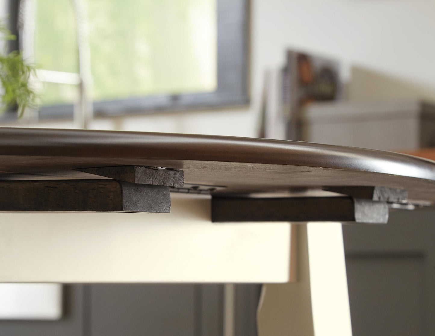 Woodanville Round DRM Drop Leaf Table - Discount Furniture Connection
