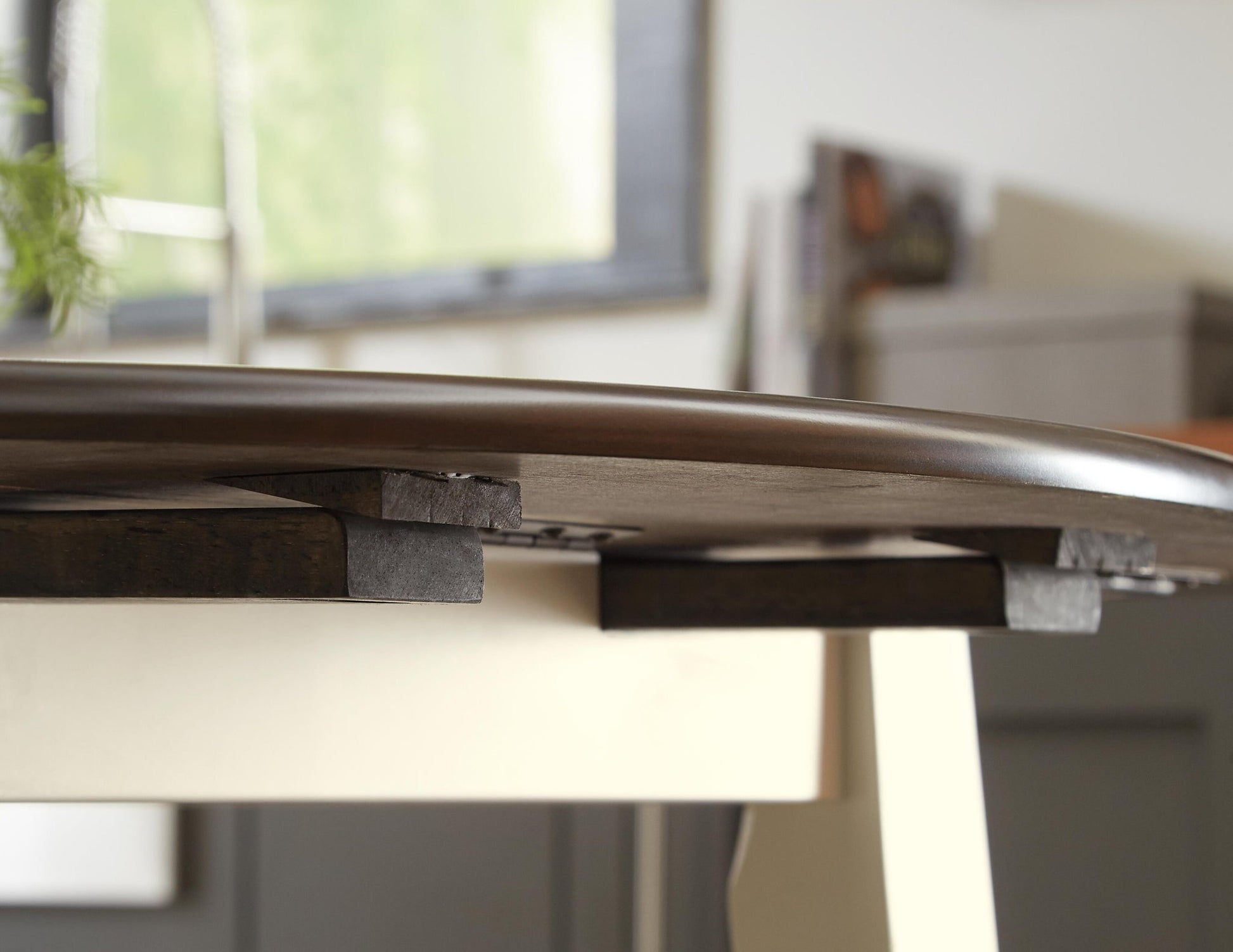 Woodanville Round DRM Drop Leaf Table - Discount Furniture Connection