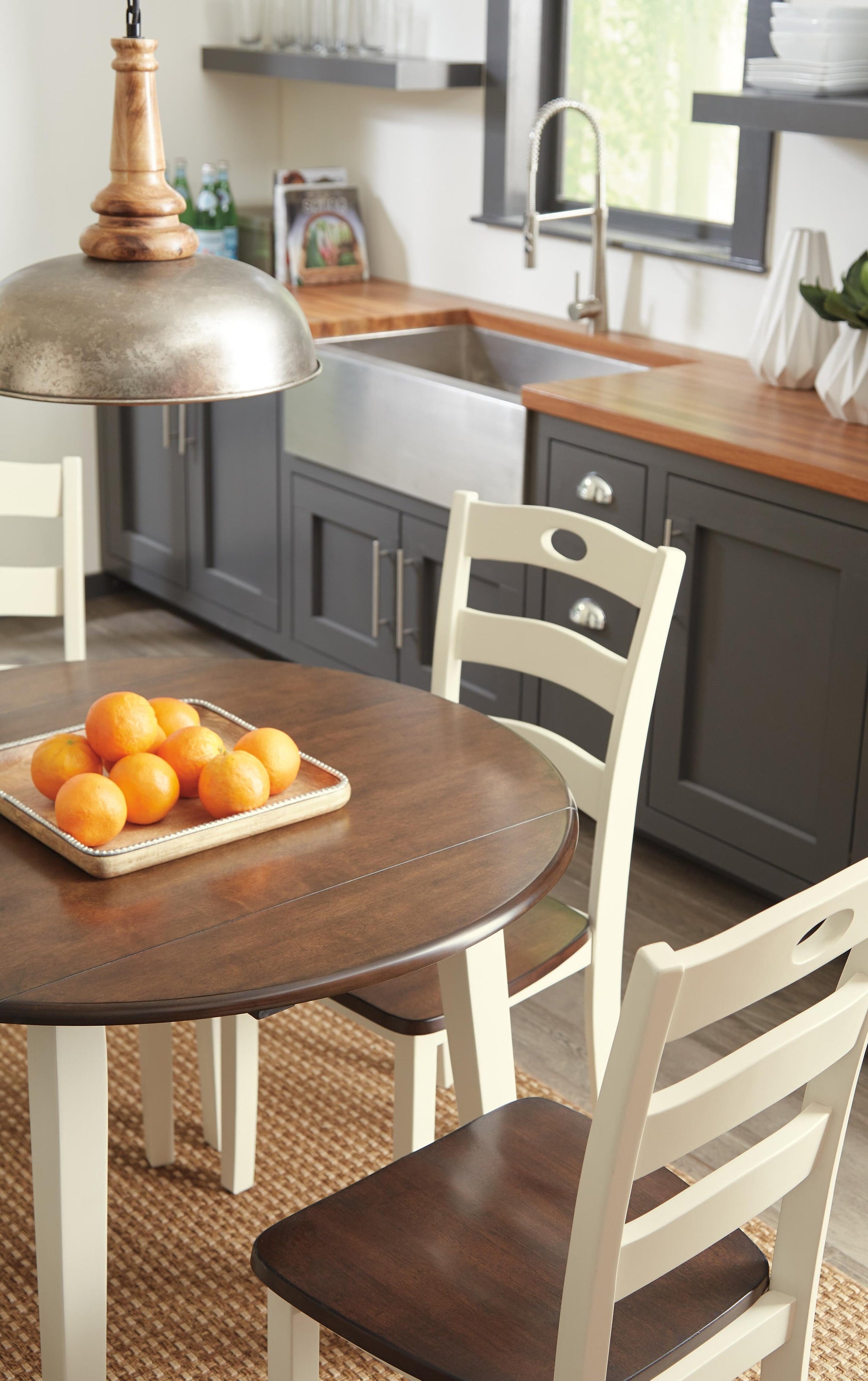 Woodanville Round DRM Drop Leaf Table - Discount Furniture Connection