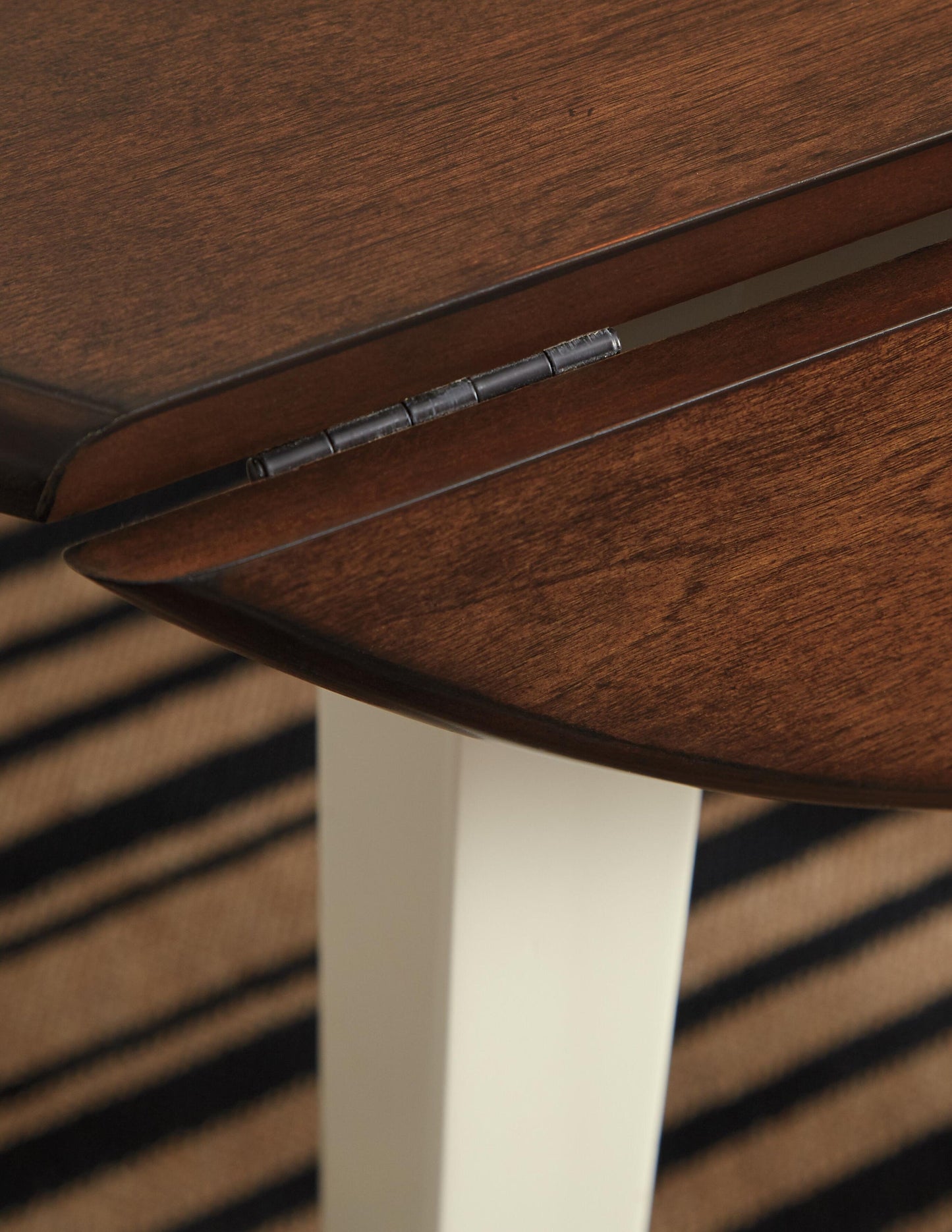 Woodanville Round DRM Drop Leaf Table - Discount Furniture Connection