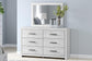 Cayboni Queen Panel Bed with Mirrored Dresser - Discount Furniture Connection