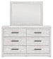 Cayboni King Panel Bed with Mirrored Dresser - Discount Furniture Connection